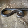 Fire Poker close up of fireside poker handle, forged by hand into an elegant swirl