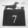 Metal house sign with Dachshund design.