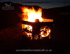 Hexagonal Firepit The Hexagonal Firepit by Black Fox Metalcraft Ltd, featuring intricate laser-cut designs, casts a warm glow against the dark expanse of the Scottish Highlands.