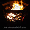 Hexagonal Firepit The Hexagonal Firepit by Black Fox Metalcraft Ltd features bespoke, laser-cut designs of trees and a stag, evoking the Scottish Highlands, and elegantly cradles burning logs. For more details, visit our website.