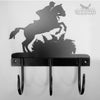 Horse Trials Coat Hooks The Horse Trials Coat Hooks by Black Fox Metalcraft Ltd showcase a horse and rider silhouette jumping over an obstacle. With hand-forged craftsmanship, they feature three black powder-coated hooks below.