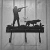 Shooting with Pointer Coat Hooks The Shooting with Pointer Coat Hooks by Black Fox Metalcraft Ltd features a hunter and dog silhouette on a wooden panel, complete with a metal wall hook. Its personalized design makes it an ideal gift for hunting enthusiasts.