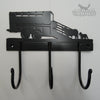 Sheep and Trailer Coat Hooks The Sheep and Trailer Coat Hooks by Black Fox Metalcraft Ltd feature a livestock truck with animal silhouettes. This black metal rack has three hand-forged hooks and a durable, black powder coat finish, blending rustic charm with sturdy functionality for your home.