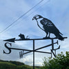 Hawk Weathervane photo with blue sky and light cloud in the background.