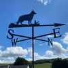 Alsatian dog weathervane by Black Fox Metalcraft. Photographed with a blue summer sky.