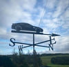 Aston martin Weathervane photo with cloudy sky background