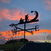 Weather vane featuring the Clangers, with a beautiful sunset sky