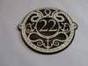 Black Fox Metalcraft Ltd's Metal Art Address Sign displays the number 22 in black and white Art Nouveau style, featuring rope, anchor, and wave designs—ideal for those seeking custom metal signs with a nautical touch.
