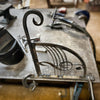 Unusual hanging basket bracket being TIG welded at the black fox metalcraft workshop.
