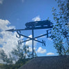 Classic Morgan weathervane photographed mounted to a summerhouse.