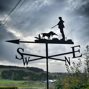 Shooting weather vane featuring a man and his Labrador