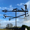 The Shooting with Labradors Weathervane by Black Fox Metalcraft Ltd features silhouettes of a hunter, gun dog, and pheasant with S, E, W, N directional letters—an ideal personalised shooting gift for rural lovers.