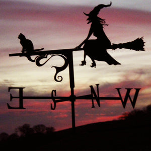 Witch weathervane pink sunset