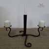 Candle holder forged by hand from a reclaimed garden fork.