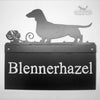 Metal house sign with Dachshund design.
