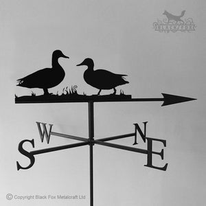 Ducks weathervane with traditional arrow.