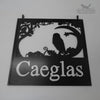 Hanging sign featuring an Owl in an Oak tree.