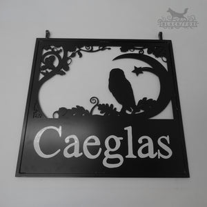 Hanging sign featuring an Owl in an Oak tree.