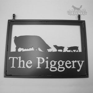 Swinging sign featuring Pigs.