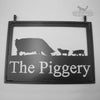 Hanging farm sign featuring Pigs.