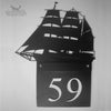 Hand painted metal house sign with Tall Ship  design.