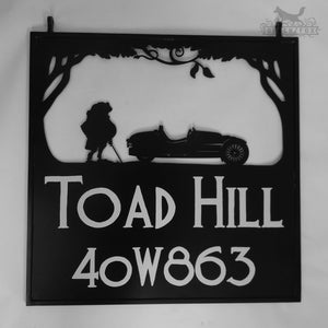 Swinging sign featuring Mr. Toad and his car.