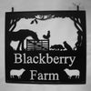 Traditional farm scene depicted in a laser cut swinging sign.