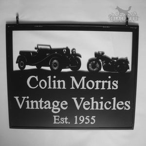 A hanging sign from Black Fox Metalcraft Ltd reads "Vintage Vehicles Est. 1955" with silhouettes of a vintage car and motorcycle, perfectly capturing the essence of a classic car restoration company.